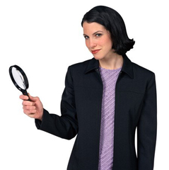 Picture of a woman holding a magnifying glass